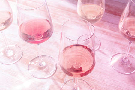 Glasses of rose wine, toned in pinkの写真素材