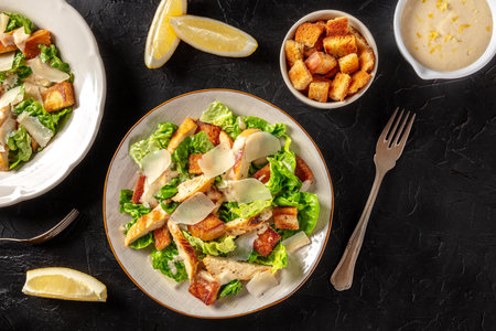 Caesar salad with grilled chicken, romaine and Parmesanの写真素材