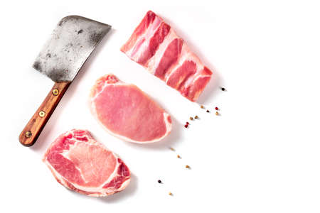 Raw pork meat, different cuts, shot from above on a white backgroundの写真素材