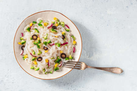 Konjac pasta with broccoli and onions, top shot with a place for textの写真素材