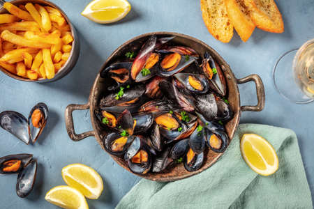 Mussels, overhead flat lay shot on a blue backgroundの写真素材