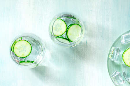 Detox cucumber drink with ice, shot from the topの写真素材