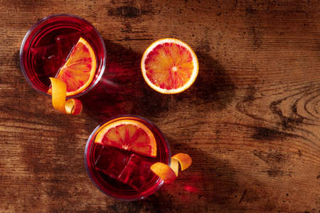 Cocktails with blood orange juice, overhead shot with copy spaceの写真素材