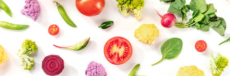 Fresh vegetable panorama on a white background, top shot