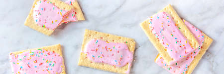 Strawberry  tarts panorama. Many toaster pastries, an overhead flat lay shotの写真素材