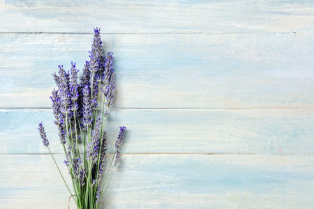 Lavender flower bouquet, overhead shot on a rustic wooden background with a place for text
