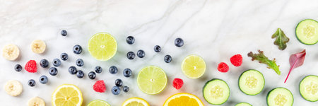 Fresh summer food menu banner with copy space. Fruit and vegetables, shot from the top on a white...