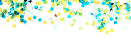 Happy birthday or any holiday festive background with confetti and copy space, a panorama. Carnival greeting card with golden stars, on a white backgroundの写真素材