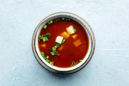 Tofu soup, Japanese cuisine. Miso soup with bean curd and green onions, a staple of Asian cuisine, shot from the topの写真素材