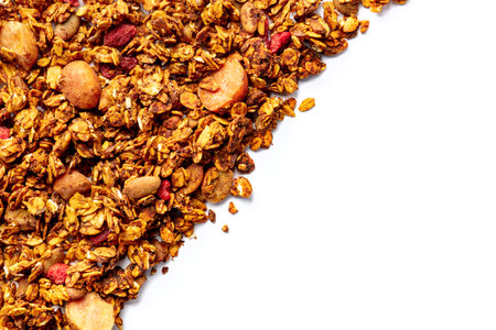 Granola texture on a white background, with copy space. Organic gourmet muesli, overhead flat lay shotの写真素材