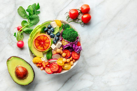 Buddha Bowl. Rainbow salad. Vegan poke bowl with avocado. Healthy food. Overhead flat lay shot with ingredients and copy spaceの写真素材