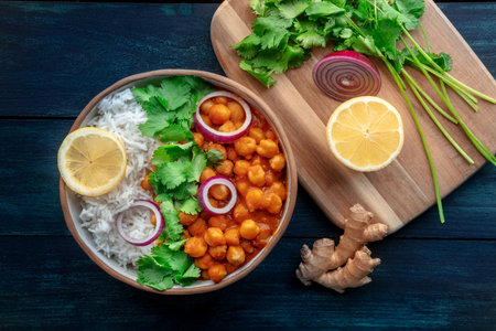Chana masala, chickpea curry, traditional Indian dish, overhead flat lay shot with fresh ingredientsの写真素材