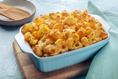 Mac and Cheese, macaroni pasta, oven-baked in a casserole with cream, homemade American dish