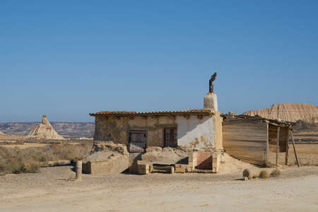 a desert house in a desertic land in Navarra, Spain. Bardenas Reales is a desertic land in the middle of Spain. An old house resists the high temperature.の写真素材