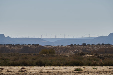 Wind turbines on the hill of a mountain in a beautiful sunset