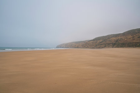 huge paradise beach in morocco near village of asilahの写真素材