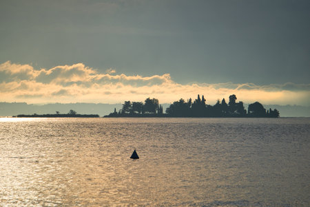 Sunrise over the only island in Lake Gardaの写真素材