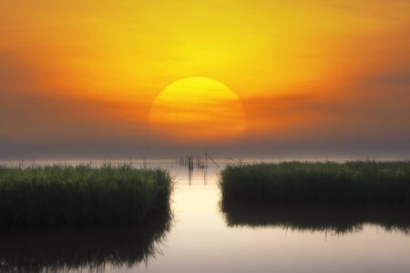 Beautiful sunrise from the lake Pakpra, Phatthalung province, South of Thailand.の写真素材