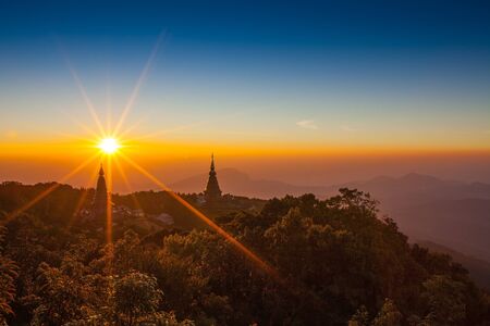 Morning scene,Silhouette of Pagoda on the top of mountain at Intanon national park, Thailandの写真素材