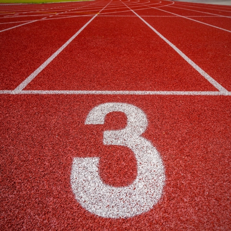 Number three on the start of a running track の写真素材
