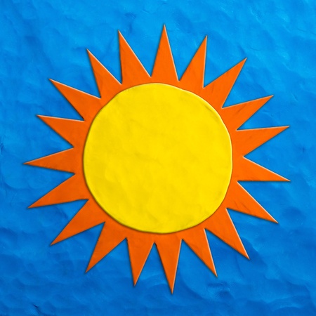 Color children s sun plasticine on a blue background の写真素材