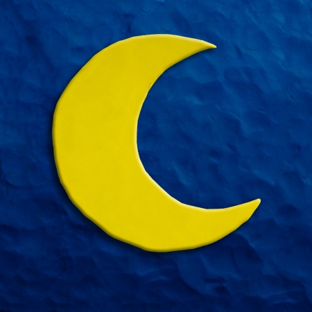 Color children s moon plasticine on a dark blue backgroundの写真素材