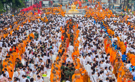 BANGKOK , THAILAND - September 8 : unidentified people give food and drink for alms to 10,000...