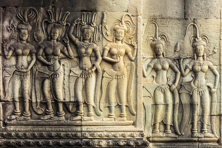 Apsara Dancers Stone Carving,all around on the wall at Angkor wat. の写真素材