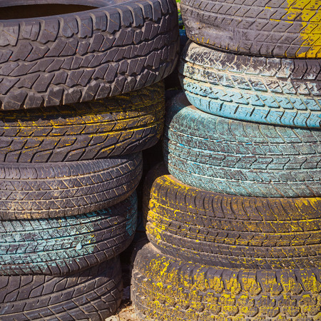 Pile of old tires and wheels for rubber. Closeup for design work の写真素材
