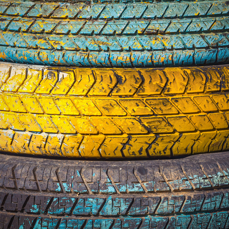 Pile of old tires and wheels for rubber. Closeup for design work の写真素材