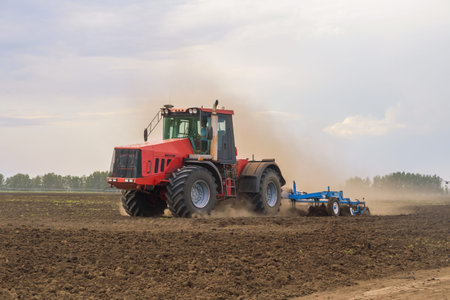 tractor plowing the land.