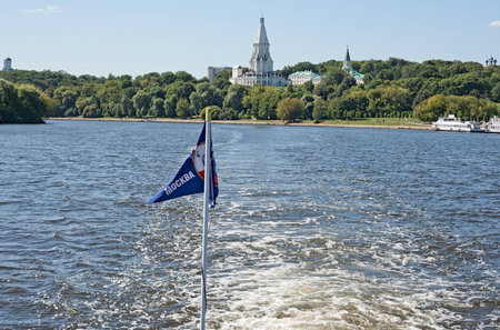 Pennant of the motor ship and trace on water near the town Kolomna in Moscow.の写真素材