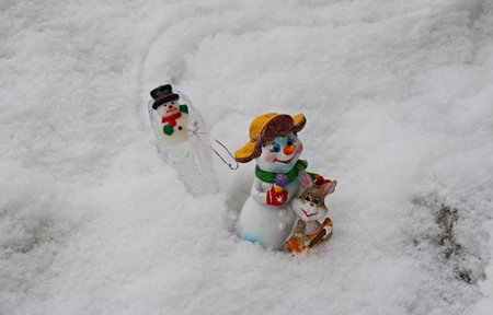 New Year's toys make the way through the Russian snow home after New Year's and Christmas holidays.の写真素材