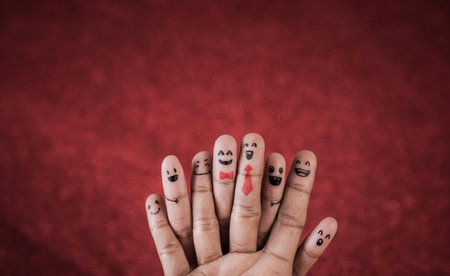 Finger with emotion on red background
