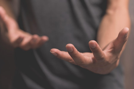 People pretending to spread their hands to hold things