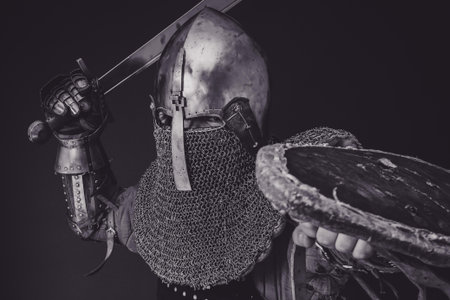 Man with Steel And Chainmail Armor Holding Sword