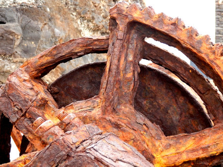 Rusted cog - part of a steam winch located at the old Pier Wilson Coal Wharf at Funchal on the...