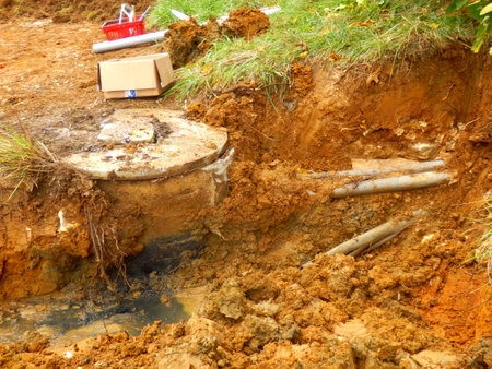 Broken concrete water storage tank used to collect waste water from a septic tank. Dirty water can...