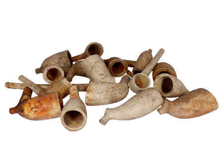 Collection of broken Victorian clay pipes dug up from a disused Victorian tip in Cardiff, Walesの写真素材