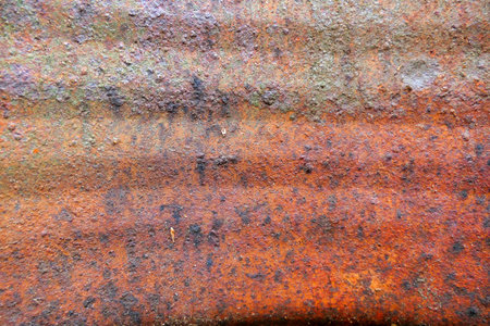 Close up of the internal surface of a rusty oil barrel