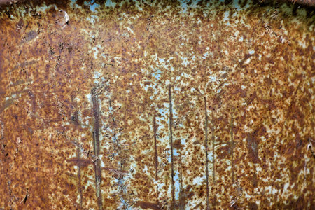 Close up of the external surface of a rusty oil barrel