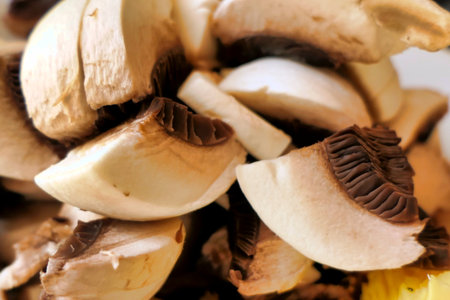 Freshly picked Amanita Caesarea Mushrooms diced and sliced to be fried with Ceps and Brown Button mushrooms for a delicious mealの写真素材