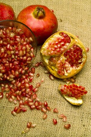 Pomegranete on natural brown sheetの写真素材