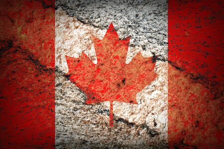  Image of an old canadian flag on the rock textureの写真素材