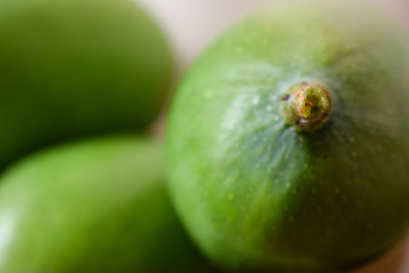 Green figs on a wooden background. Selective focus. Shallow depth of field.の写真素材