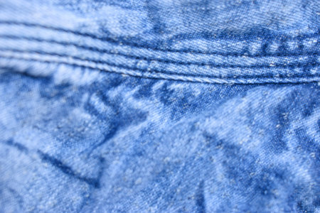 Folded Blue Denim Shirt Fabric Texture Close Up Background