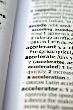Close Up Of English Dictionary Page With Word -    Accelerate  Image
