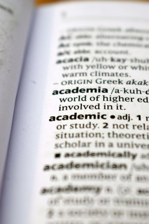 Close Up Of English Dictionary Page With Word -   Academic   Image