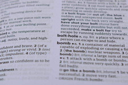 English Definition Dictionary Page Of Printed Word -  Bomb  Close Up Image