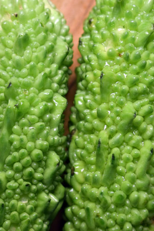 Green Vegetable Bitter Melon Or Bitter Gourd On Wooden Table Image